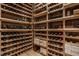 Custom wine cellar featuring wooden racks, ample storage, and temperature control for preserving wine collections at 12022 Otto Ln, Carmel, IN 46032