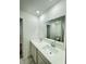 Bathroom features double sinks and bright lighting with a shower in the reflection at 1248 Cassine Pl, Greenwood, IN 46143