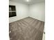 Well-lit bedroom with plush carpet and a white trim window at 1248 Cassine Pl, Greenwood, IN 46143