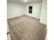Neutral bedroom featuring carpet, a window with bright natural light, and a standard entry door at 1248 Cassine Pl, Greenwood, IN 46143