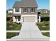 Charming two-story home with manicured lawn and pond view at 1248 Cassine Pl, Greenwood, IN 46143