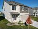 Charming home with neutral siding, a two-car garage, and a professionally landscaped front yard at 1248 Cassine Pl, Greenwood, IN 46143