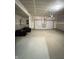Spacious two-car garage with ample storage space, overhead door, and clean concrete flooring at 1248 Cassine Pl, Greenwood, IN 46143