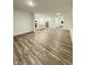 Expansive living room featuring wood flooring, abundant natural light, and an open layout at 1248 Cassine Pl, Greenwood, IN 46143