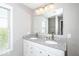 Modern bathroom features double sinks with granite countertop, and a large mirror at 12838 Bird Cage, Carmel, IN 46032