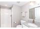 Bright bathroom featuring a walk-in shower and granite countertop with a white sink and faucet at 12838 Bird Cage, Carmel, IN 46032
