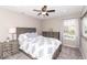 Cozy bedroom features a comfortable bed, neutral tones and plenty of natural light at 12838 Bird Cage, Carmel, IN 46032