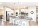 Bright kitchen with a large center island, stainless steel appliances and white cabinetry at 12838 Bird Cage, Carmel, IN 46032