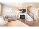 Inviting living room features a fireplace, plush seating, and a cozy atmosphere at 12838 Bird Cage, Carmel, IN 46032
