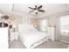 Serene main bedroom boasts a tray ceiling, soft lighting and ample closet space at 12838 Bird Cage, Carmel, IN 46032