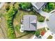 A captivating aerial view showcases the home's backyard oasis, complete with a deck, outdoor seating and fire pit at 14095 Northcoat Pl, Fishers, IN 46038