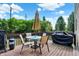 Outdoor deck featuring a dining set and grill, perfect for entertaining and enjoying outdoor meals at 14095 Northcoat Pl, Fishers, IN 46038