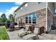 Backyard patio with lounge chairs, wooden deck, and lush landscaping, perfect for relaxation at 14095 Northcoat Pl, Fishers, IN 46038