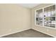 Bright, empty bedroom with neutral walls, carpet flooring, and a large window providing natural light at 14095 Northcoat Pl, Fishers, IN 46038