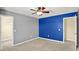 Spacious bedroom features a ceiling fan, neutral carpet, and a walk-in closet for ample storage space at 14095 Northcoat Pl, Fishers, IN 46038