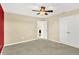 This bright bedroom features a ceiling fan and closet space, creating an organized and peaceful retreat at 14095 Northcoat Pl, Fishers, IN 46038