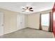 This comfortable bedroom features a ceiling fan and a large window for natural light, creating a relaxing atmosphere at 14095 Northcoat Pl, Fishers, IN 46038