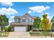 Charming two-story home featuring a brick facade and a well-manicured front yard on a sunny day at 14095 Northcoat Pl, Fishers, IN 46038