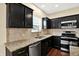 Bright kitchen with stone countertops, stainless steel appliances, and plenty of cabinet space at 14095 Northcoat Pl, Fishers, IN 46038