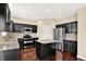 Charming kitchen with granite countertops, stainless steel appliances, and a center island at 14095 Northcoat Pl, Fishers, IN 46038