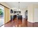 Beautiful kitchen featuring dark wood cabinets and an open layout to the dining area at 14095 Northcoat Pl, Fishers, IN 46038