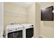Convenient laundry room featuring a pair of white, front-loading machines at 14095 Northcoat Pl, Fishers, IN 46038