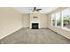 Open living room with a fireplace, neutral walls, and plush carpeting at 14095 Northcoat Pl, Fishers, IN 46038
