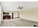Open-concept living area with hardwood floors and seamless flow to the kitchen at 14095 Northcoat Pl, Fishers, IN 46038