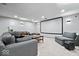 Finished basement with comfortable seating, perfect for movie nights and relaxation at 143 W Clear Lake Ct, Westfield, IN 46074