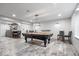 Basement game room with pool table and bar area, great for entertaining guests at 143 W Clear Lake Ct, Westfield, IN 46074