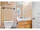 Cozy half bath with wood vanity and granite countertop, providing convenience and style at 143 W Clear Lake Ct, Westfield, IN 46074