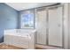 Modern bathroom features soaking tub and glass shower enclosure, offering a spa-like experience at 143 W Clear Lake Ct, Westfield, IN 46074