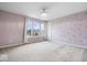 Bright bedroom with light-purple walls, plush carpeting, and abundant natural light from a large window at 143 W Clear Lake Ct, Westfield, IN 46074