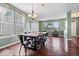 Spacious dining room with hardwood floors, modern light fixture, and large windows at 143 W Clear Lake Ct, Westfield, IN 46074