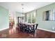 Spacious dining room with hardwood floors, modern light fixture, and large windows at 143 W Clear Lake Ct, Westfield, IN 46074