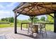 Outdoor gazebo with charming barrel-style seating, perfect for relaxing and enjoying the serene views at 143 W Clear Lake Ct, Westfield, IN 46074