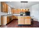 Well-lit kitchen features stainless steel appliances, hardwood floors, and a center island with seating at 143 W Clear Lake Ct, Westfield, IN 46074