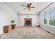 Cozy living room with a brick fireplace, neutral carpet, and plenty of natural light at 143 W Clear Lake Ct, Westfield, IN 46074