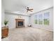 Cozy living room with a brick fireplace, neutral carpet, and plenty of natural light at 143 W Clear Lake Ct, Westfield, IN 46074