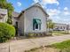 Charming home featuring a decorative front door and well-maintained landscaping at 146 E Broadway St, Shelbyville, IN 46176