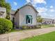 Charming home featuring a decorative front door and well-maintained landscaping at 146 E Broadway St, Shelbyville, IN 46176