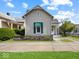 Charming home featuring a decorative front door and well-maintained landscaping at 146 E Broadway St, Shelbyville, IN 46176