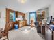 A functional kitchenette space with wood cabinets, bright windows, and carpeted floors at 146 E Broadway St, Shelbyville, IN 46176