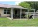 Cozy covered backyard patio perfect for outdoor dining and entertaining, overlooking a well-manicured lawn at 1504 Gwinn Ln, Lapel, IN 46051
