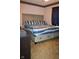 Comfortable bedroom with a large bed, plush carpet, and cozy decor at 1504 Gwinn Ln, Lapel, IN 46051