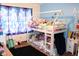 Adorable bedroom featuring a playful bunk bed, complemented by bright blue walls and themed curtains at 1504 Gwinn Ln, Lapel, IN 46051