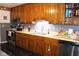 Functional kitchen with wood cabinets, stainless steel appliances, and ample counter space at 1504 Gwinn Ln, Lapel, IN 46051