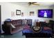 Inviting living room featuring comfortable seating, a television, and charming decor at 1504 Gwinn Ln, Lapel, IN 46051