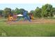 A large, colorful playground with slides, swings, and climbing structures sits on a grassy lawn at 1504 Gwinn Ln, Lapel, IN 46051