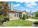 Exterior view of the home showcasing the well-maintained lawn and mature landscaping at 16130 Matlock Cir, Westfield, IN 46074
